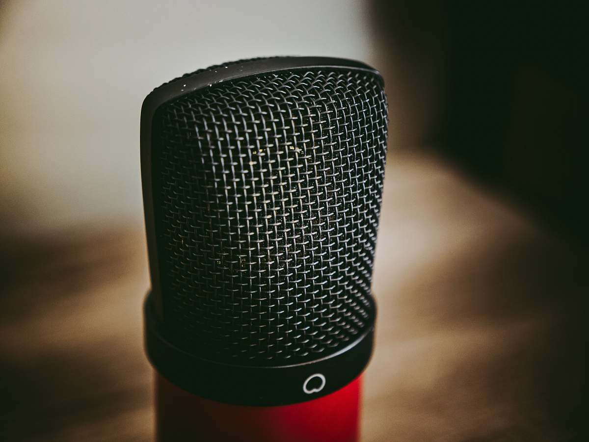 microphone black and red microphone on brown wooden table mic